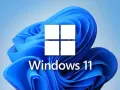 Logo Windows 11 na tle niebieskich fal. To jest co to jest Windows - system operacyjny.