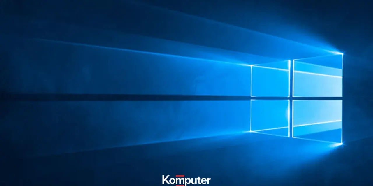 Niebieskie tło z logo Windows. Dowiedz się, jak wyłączyć laptopa, aby bezpiecznie zakończyć pracę.