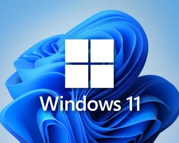 Logo Windows 11 na tle niebieskich fal. To jest co to jest Windows - system operacyjny.