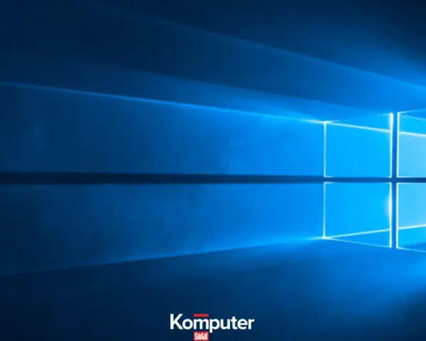 Niebieskie tło z logo Windows. Dowiedz się, jak wyłączyć laptopa, aby bezpiecznie zakończyć pracę.