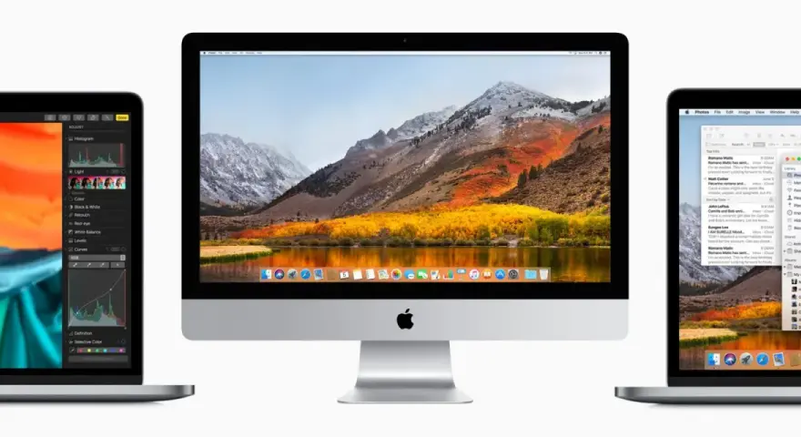 Trzy urządzenia z systemami macOS: iMac z malowniczym krajobrazem na ekranie i dwa laptopy, jeden z edytorem zdjęć, drugi z aplikacją Poczta.